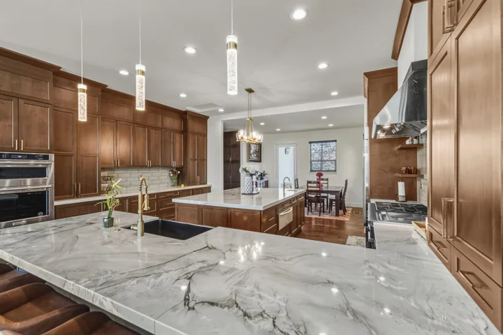 Kitchen island and wood cabinetry viewed from the dining area