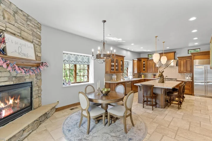 Open kitchen, dining and living space with wood floors